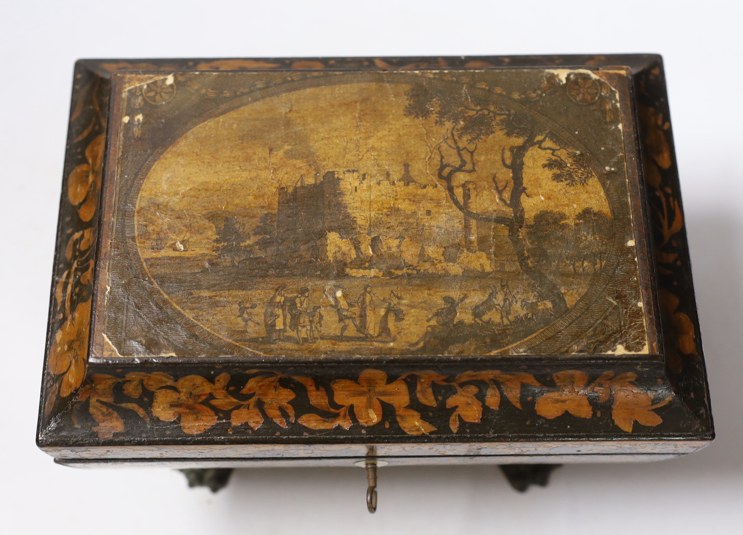 A Regency penwork tea caddy, the cover inset with an engraving of figures by a castle, 23.5 x 16 x 16cm and two small Tunbridge ware boxes